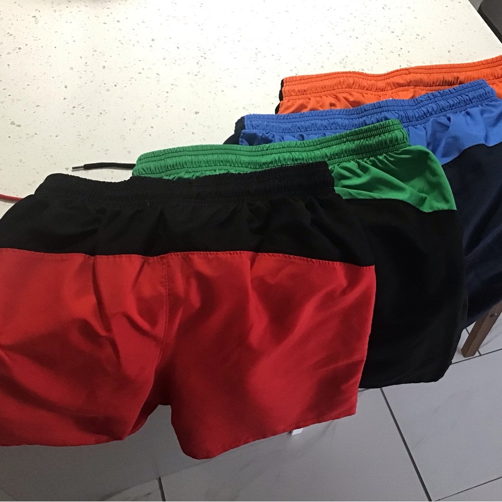 Under Armour Men’s large GUC 4 pair shorts in red, green, blue, and orange